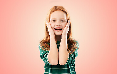 Image showing smiling red haired girl in striped shirt