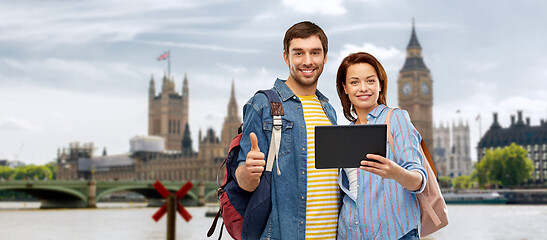 Image showing couple of tourists with tablet computer in london