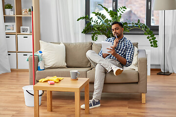 Image showing indian man making to do list after home cleaning