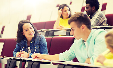 Image showing group of students with notebooks in lecture hall