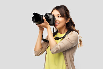 Image showing asian female photographer with digital camera