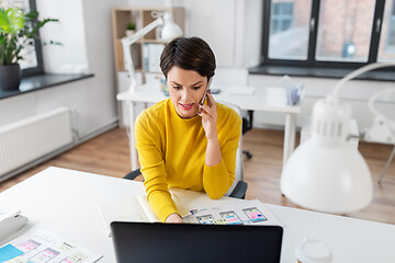 Image showing ui designer calling on smartphone at office