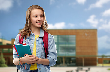 Image showing happy smiling teenage student girl with school bag