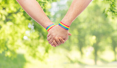 Image showing hands of couple with gay pride rainbow wristbands