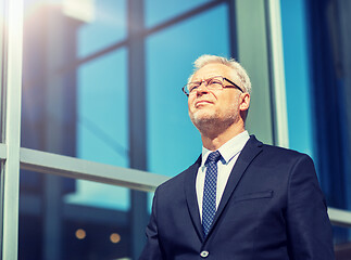 Image showing senior businessman on city street