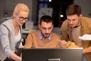 Image showing business team with computer working late at office