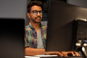 Image showing close up of creative man working at night office