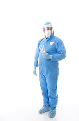 Image showing Healthcare worker in full PPE holding swabs for coronavirus pandemic