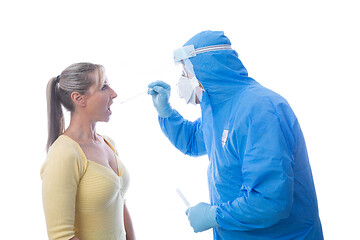 Image showing Medical pathologist swabbing a patient for an infectious virus o