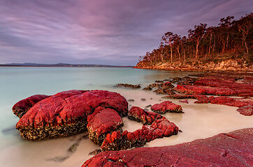 Image showing Sunset sky highlighting the red rocks and blue water of Eden