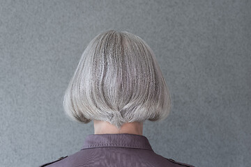 Image showing Silver-haired lady on gray background