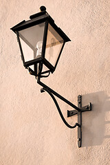 Image showing Vintage streetlight on a pink wall