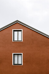 Image showing Facade and windows of an orange house