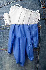 Image showing Facial mask, thermometer and latex glove in back pocket