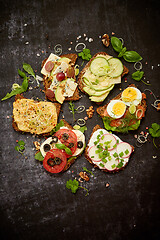 Image showing Healthy vegan sandwiches made from homemade buckwheat bread with various toppings