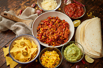 Image showing Preparing vegetable burritos on white pan. With various ingredinets for mexican food