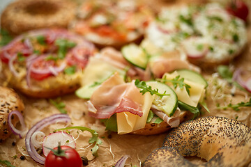 Image showing Composition of various homemade bagels sandwiches with sesame and poppy seeds