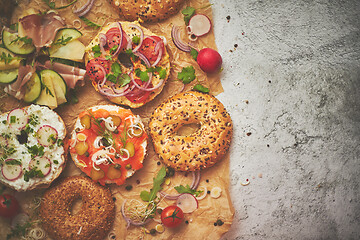 Image showing Composition of various homemade bagels sandwiches with sesame and poppy seeds