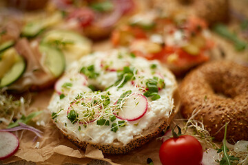 Image showing Composition of various homemade bagels sandwiches with sesame and poppy seeds