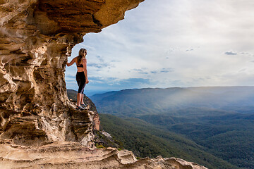 Image showing Cliff side cave with  mountain valley views