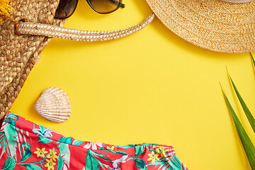 Image showing Female beach summer clothes and accessories collage on yellow ba