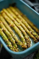 Image showing Close up with selective focus on roasted asparagus seasoned with salt, pepper, garlic.