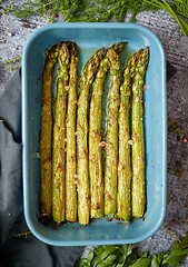 Image showing Roasted asparagus seasoned with salt, pepper, garlic and decorat