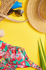 Image showing Female beach summer clothes and accessories collage on yellow background