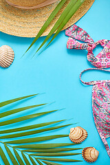 Image showing Women beach summer clothes and accessories collage on blue backg