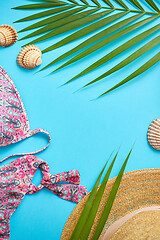 Image showing Women beach summer clothes and accessories collage on blue backg