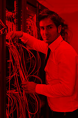 Image showing young it engineer in datacenter server room