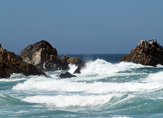 Image showing waves breakers amidst rocks at sea shore