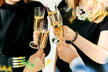 Image showing Celebration. Hands holding the glasses of champagne and wine making a toast.