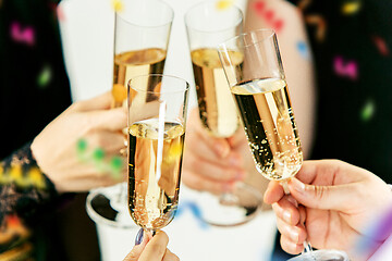 Image showing Celebration. Hands holding the glasses of champagne and wine making a toast.