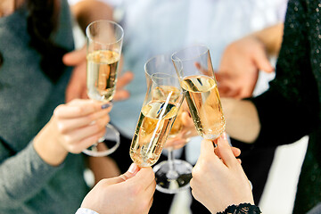 Image showing Celebration. Hands holding the glasses of champagne and wine making a toast.