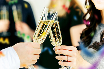 Image showing Celebration. Hands holding the glasses of champagne and wine making a toast.