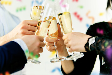 Image showing Celebration. Hands holding the glasses of champagne and wine making a toast.