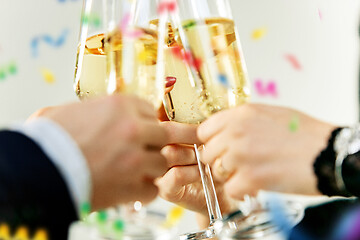 Image showing Celebration. Hands holding the glasses of champagne and wine making a toast.