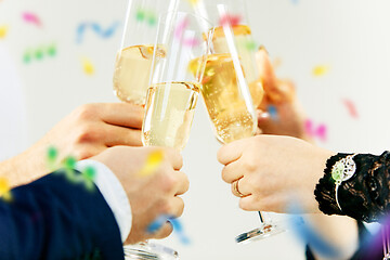 Image showing Celebration. Hands holding the glasses of champagne and wine making a toast.