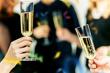 Image showing Celebration. Hands holding the glasses of champagne and wine making a toast.