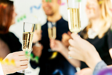 Image showing Celebration. Hands holding the glasses of champagne and wine making a toast.