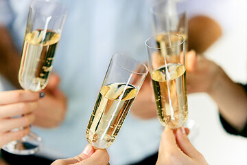 Image showing Celebration. Hands holding the glasses of champagne and wine making a toast.