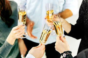 Image showing Celebration. Hands holding the glasses of champagne and wine making a toast.