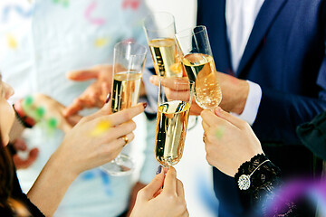 Image showing Celebration. Hands holding the glasses of champagne and wine making a toast.