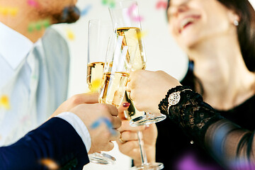 Image showing Celebration. Hands holding the glasses of champagne and wine making a toast.