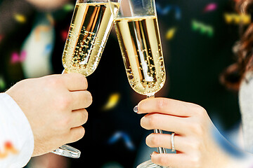 Image showing Celebration. Hands holding the glasses of champagne and wine making a toast.