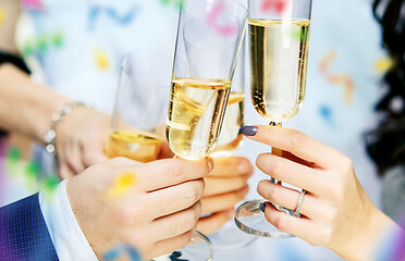 Image showing Celebration. Hands holding the glasses of champagne and wine making a toast.