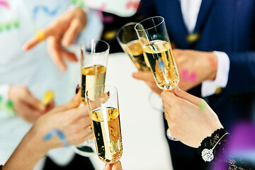 Image showing Celebration. Hands holding the glasses of champagne and wine making a toast.