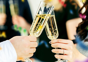 Image showing Celebration. Hands holding the glasses of champagne and wine making a toast.