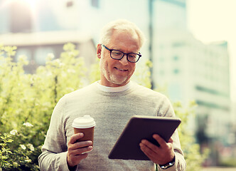 Image showing senior man with tablet pc and coffee in city